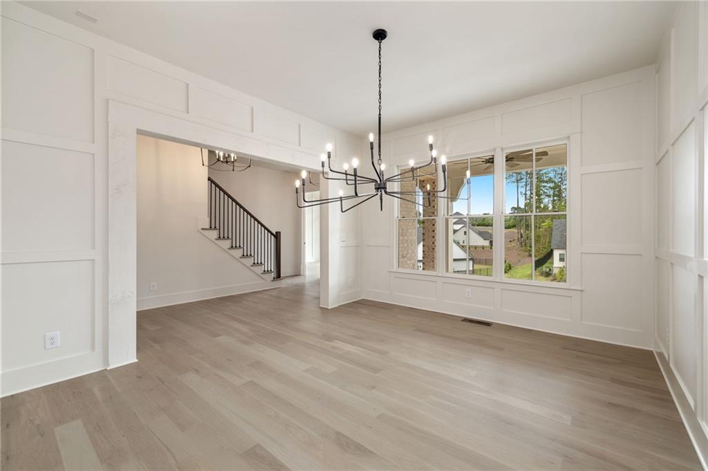2701 Conns Creek Road, Unit 53 Ball Ground, GA 30107 - Photo 8 of 19 a view of a room with window chandelier