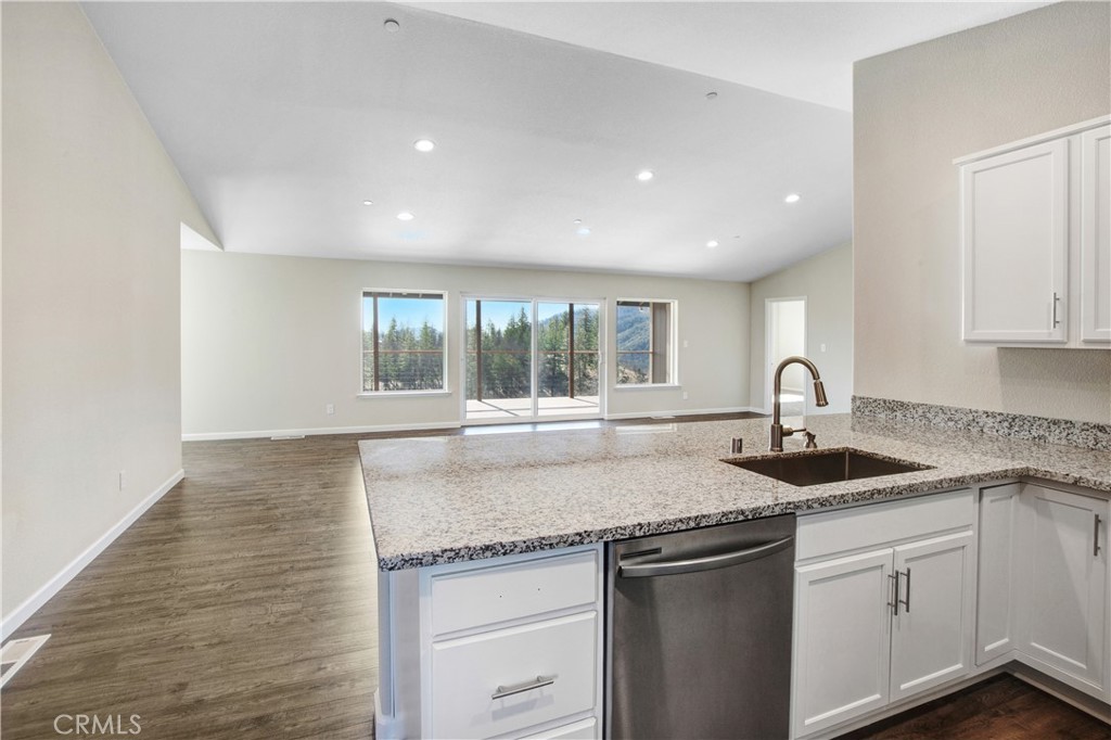 9781 Venturi Drive Cobb, CA 95426 - Photo 14 of 26 a kitchen with granite countertop kitchen island and windows