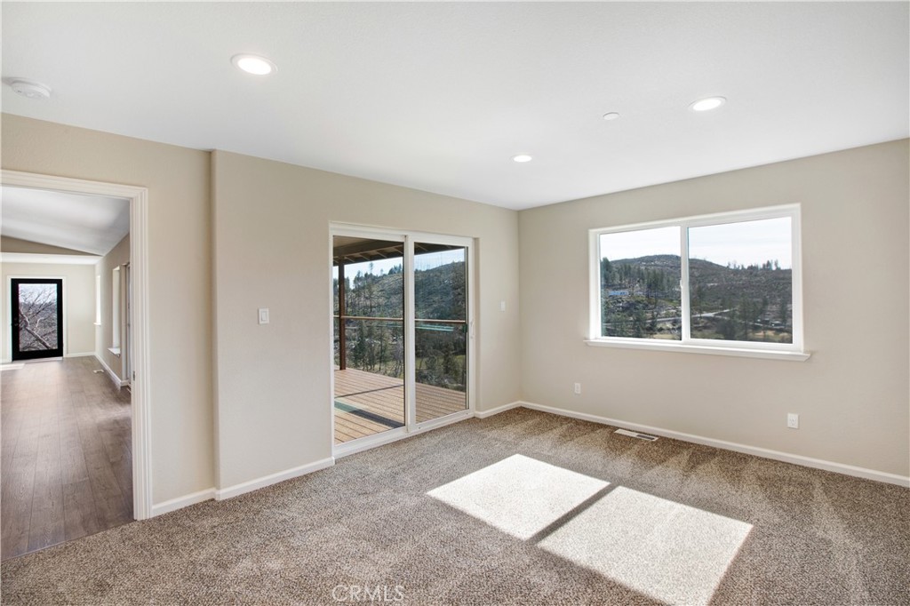 9781 Venturi Drive Cobb, CA 95426 - Photo 18 of 26 an empty room with windows
