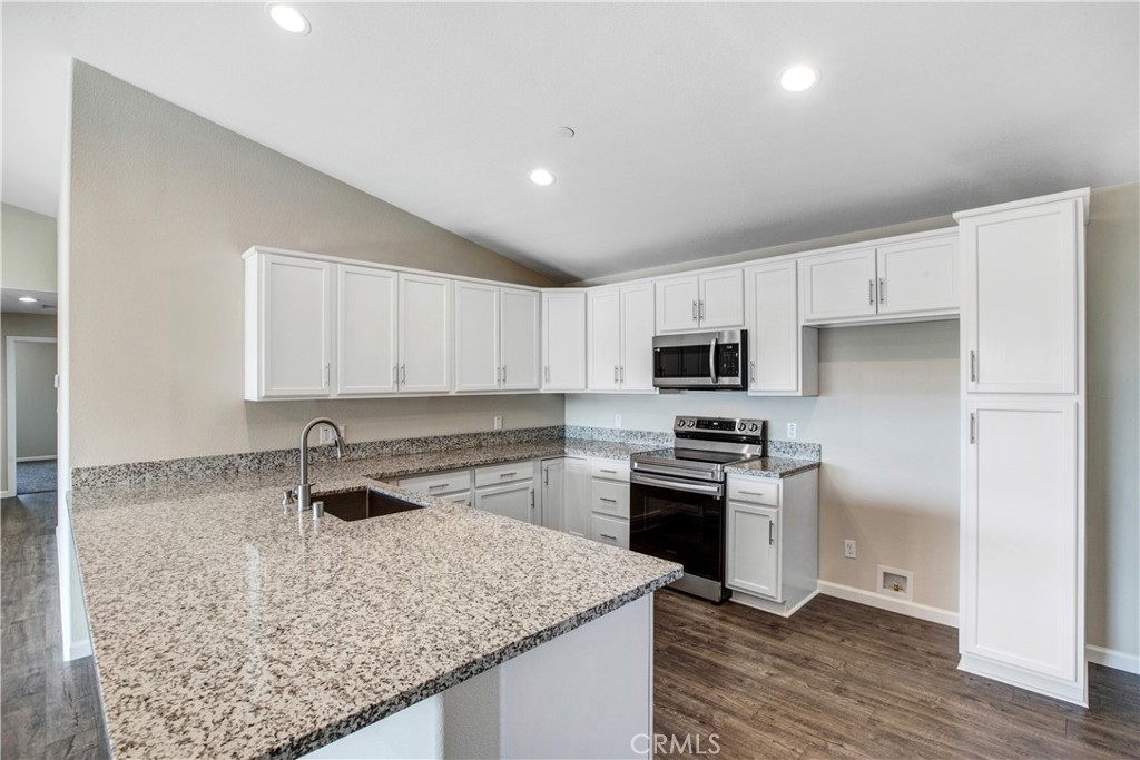 9781 Venturi Drive Cobb, CA 95426 - Photo 2 of 26 a kitchen with granite countertop a stove sink and refrigerator