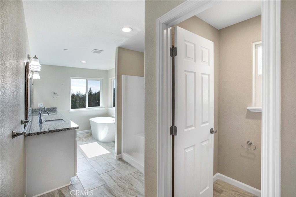 9781 Venturi Drive Cobb, CA 95426 - Photo 22 of 26 a bathroom with a toilet sink and a mirror