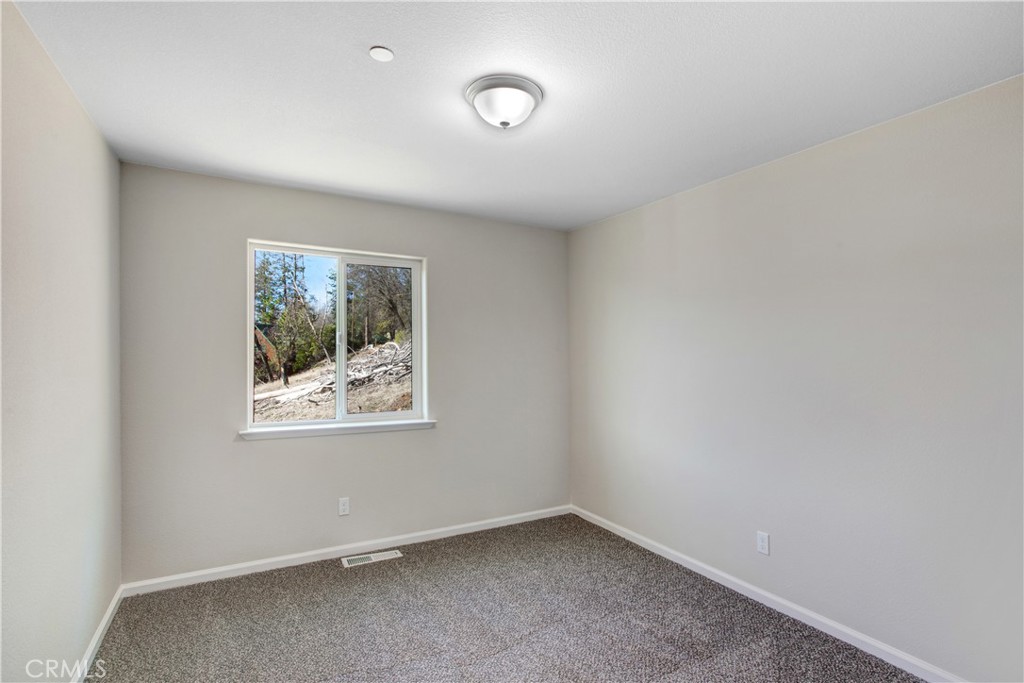 9781 Venturi Drive Cobb, CA 95426 - Photo 24 of 26 an empty room with a window