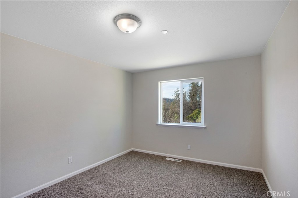 9781 Venturi Drive Cobb, CA 95426 - Photo 25 of 26 an empty room with a window