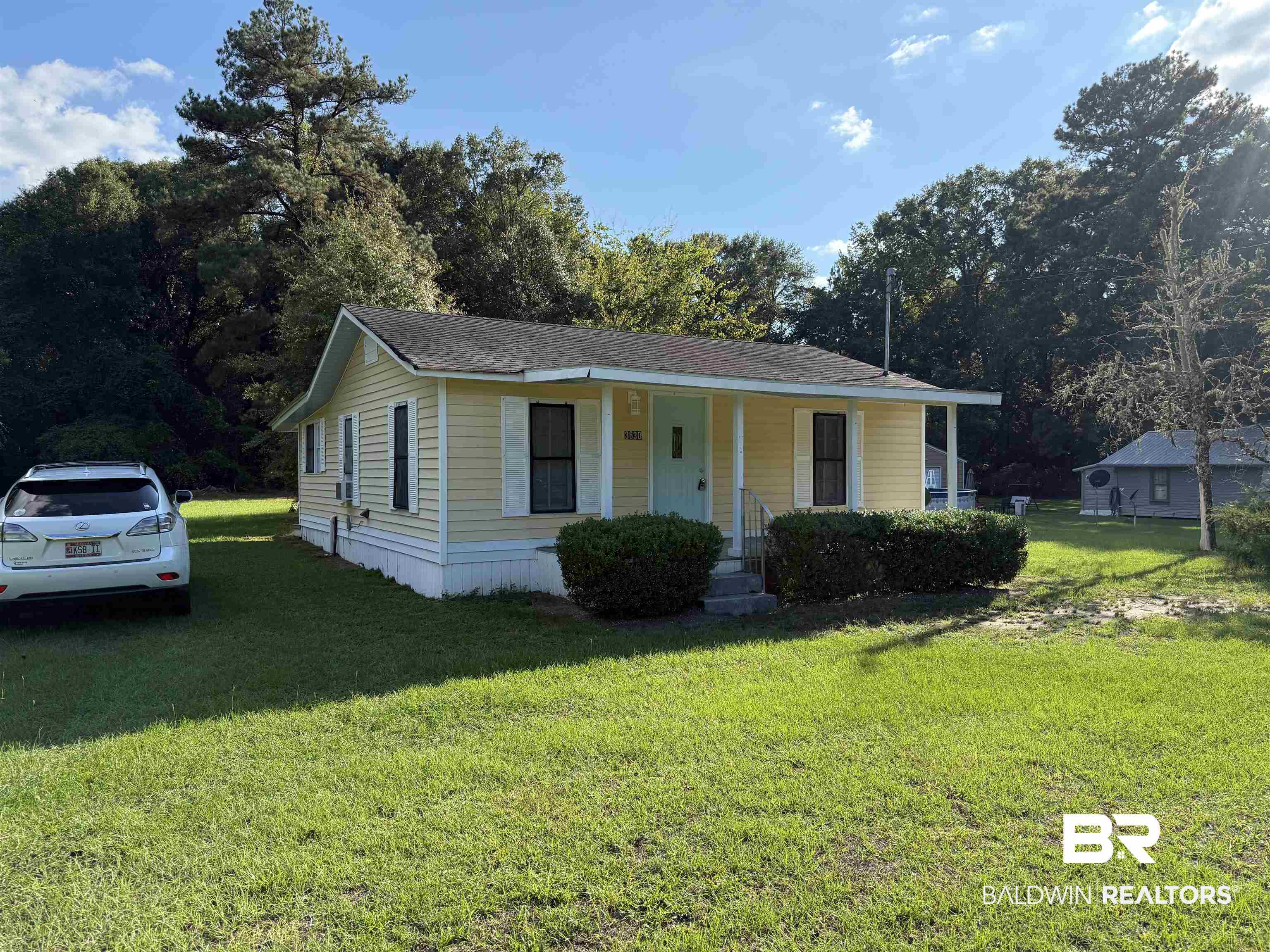 3630 Highway 29 Brewton, AL 36426 - Photo 1 of 13 View of front of property with a porch and a front lawn