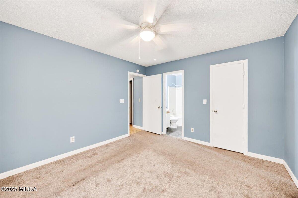 100 Mauldon Court Warner Robins, GA 31093 - Photo 14 of 20 a view of a room with a ceiling fan