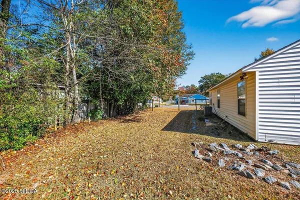 a view of a backyard of the house