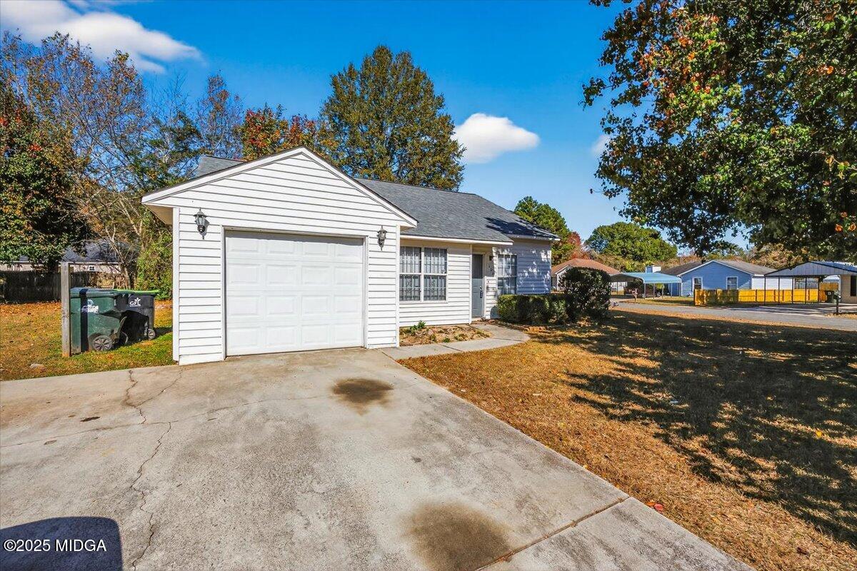100 Mauldon Court Warner Robins, GA 31093 - Photo 19 of 20 a view of a white house with a outdoor space and sitting area