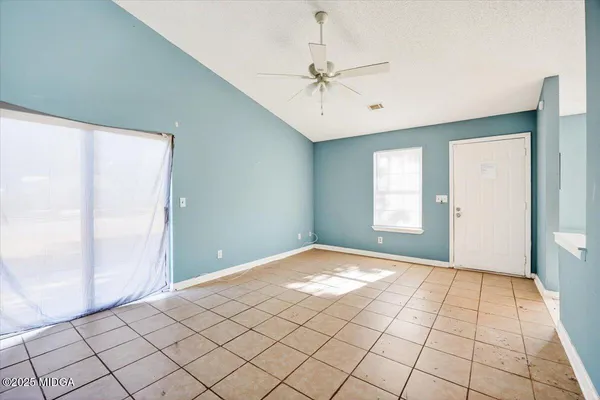 a view of an empty room and window