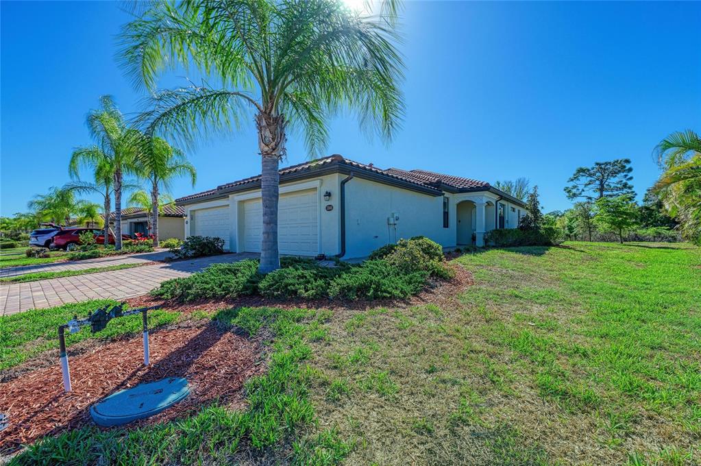 12440 Amica Loop Venice, FL 34293 - Photo 11 of 87 a view of a garden with palm trees