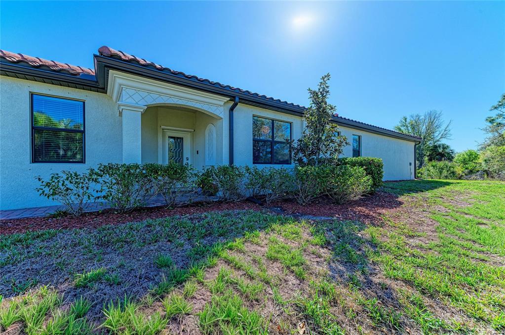 12440 Amica Loop Venice, FL 34293 - Photo 12 of 87 front view of a house with a yard
