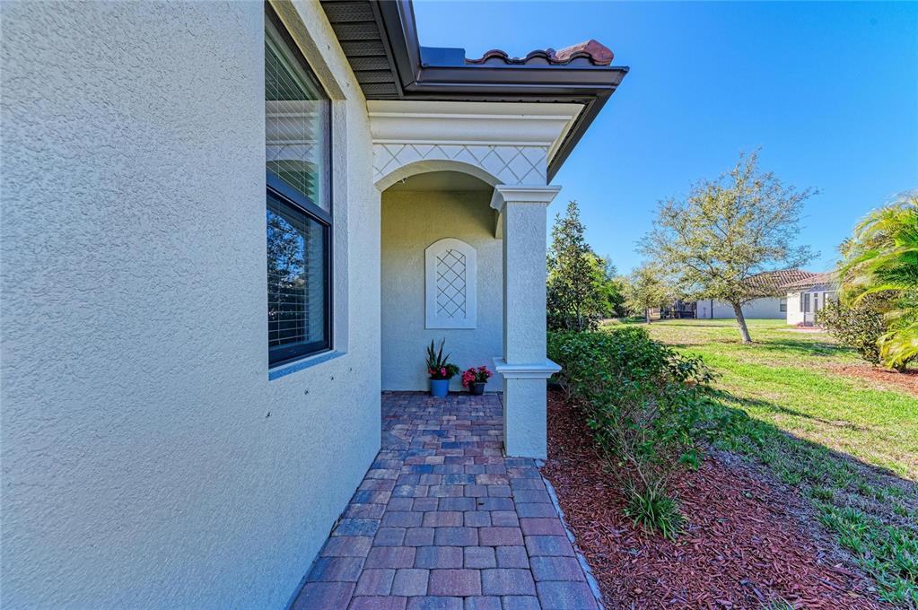 12440 Amica Loop Venice, FL 34293 - Photo 14 of 87 a view of entryway with garden