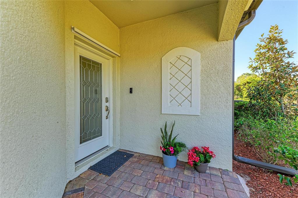 12440 Amica Loop Venice, FL 34293 - Photo 15 of 87 a view of entryway with flower pots