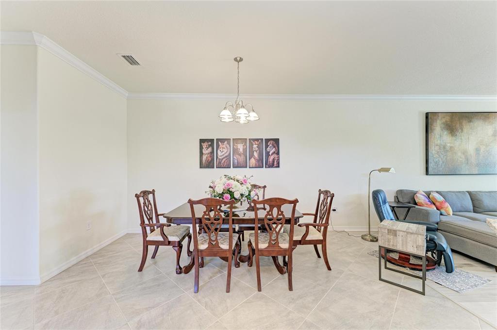 12440 Amica Loop Venice, FL 34293 - Photo 29 of 87 a dining room with furniture and window