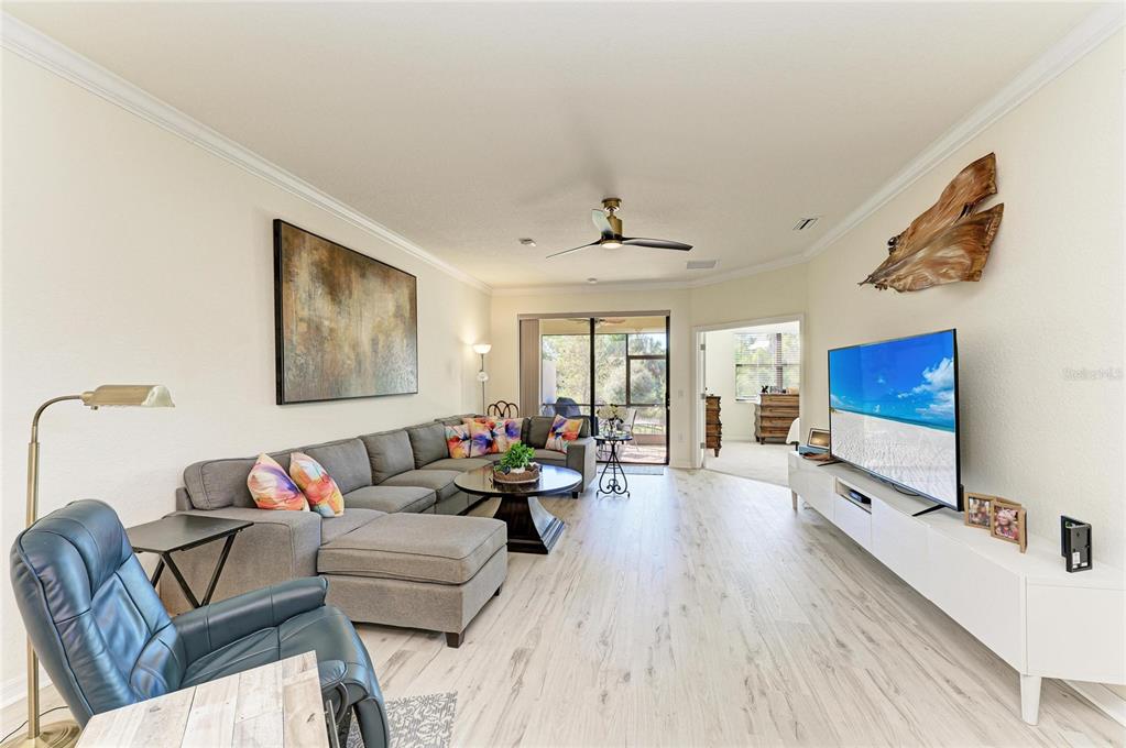 12440 Amica Loop Venice, FL 34293 - Photo 31 of 87 a living room with furniture flat screen tv and a couch