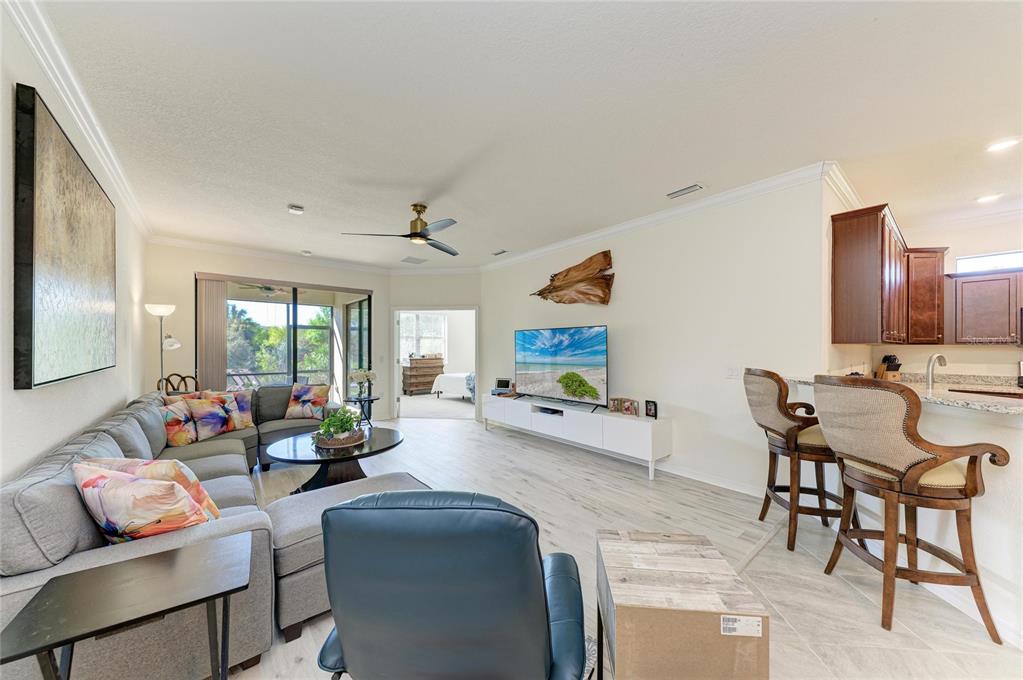 12440 Amica Loop Venice, FL 34293 - Photo 32 of 87 a living room with furniture and a large window