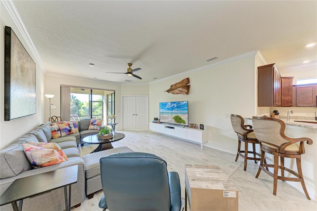 12440 Amica Loop Venice, FL 34293 - Photo 33 of 87 a living room with furniture and a large window