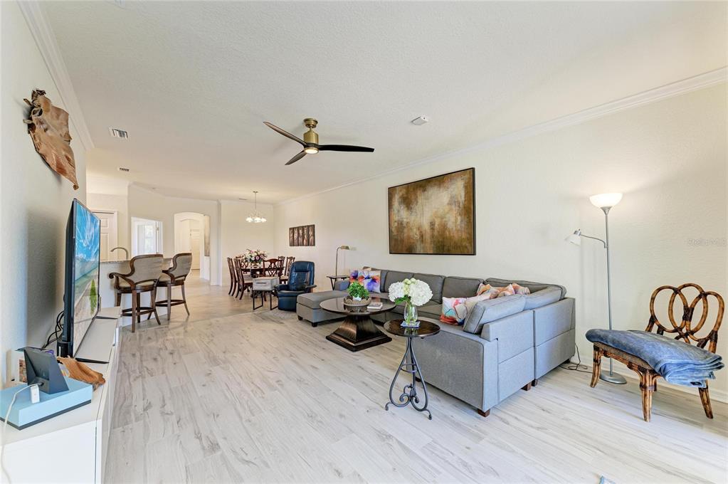 12440 Amica Loop Venice, FL 34293 - Photo 34 of 87 a living room with furniture and a flat screen tv
