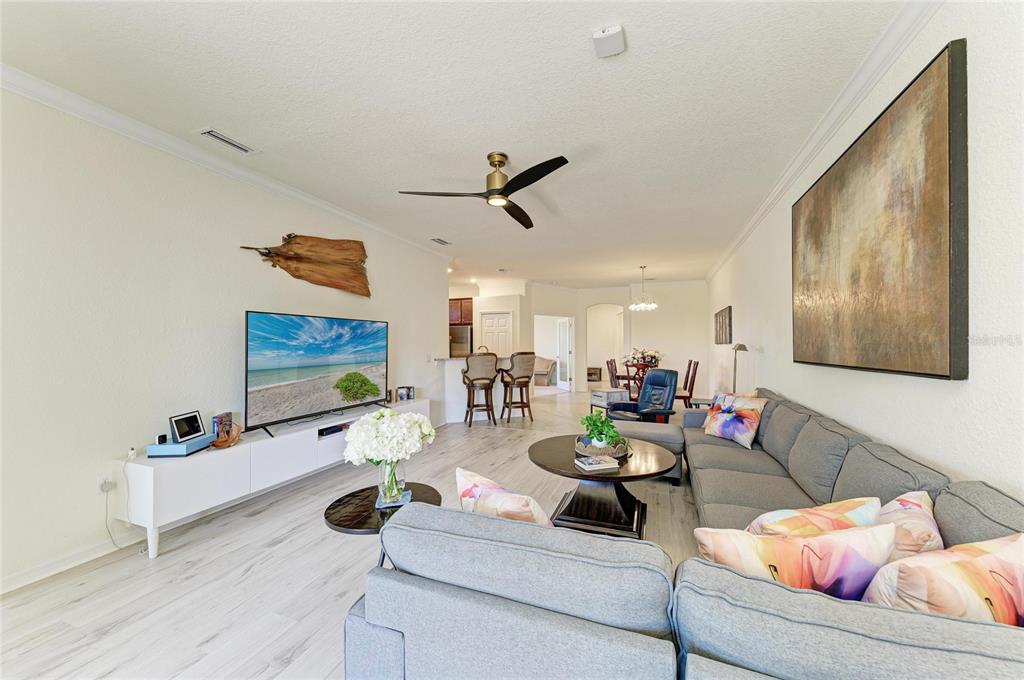12440 Amica Loop Venice, FL 34293 - Photo 36 of 87 a living room with furniture and a flat screen tv