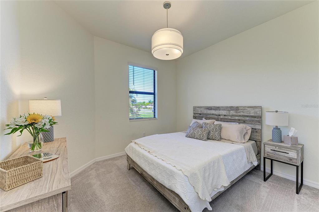 12440 Amica Loop Venice, FL 34293 - Photo 46 of 87 a bedroom with a bed and a window