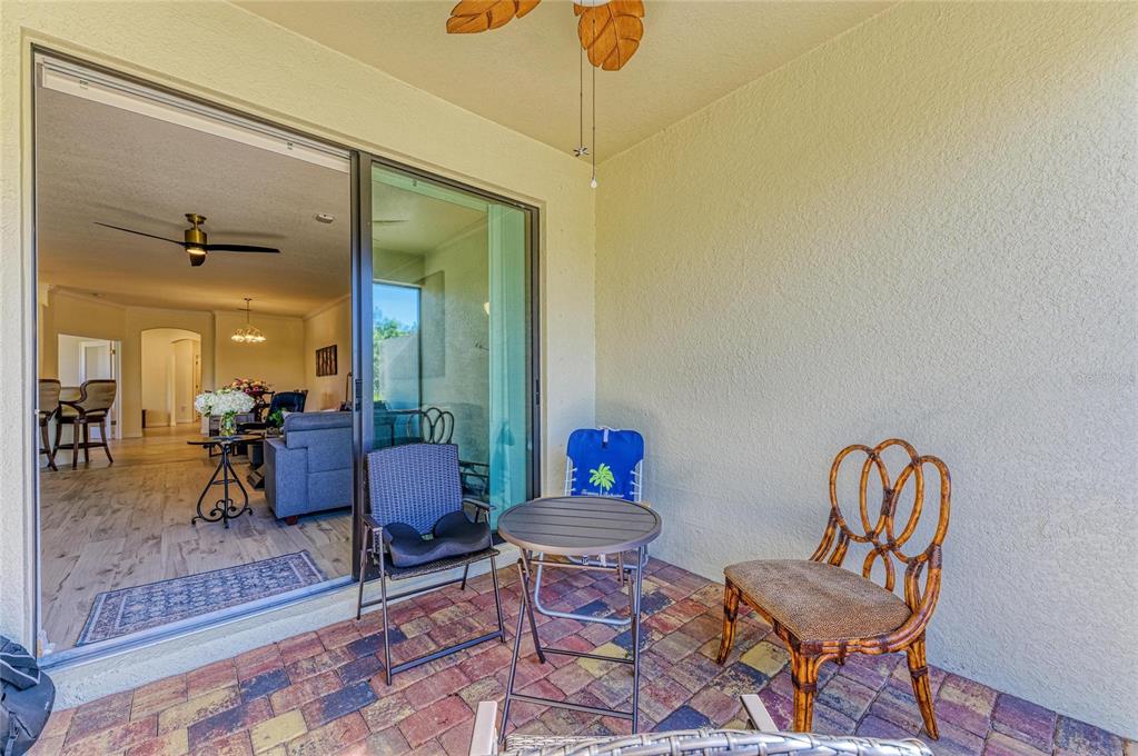 12440 Amica Loop Venice, FL 34293 - Photo 53 of 87 a living room with furniture and a rug