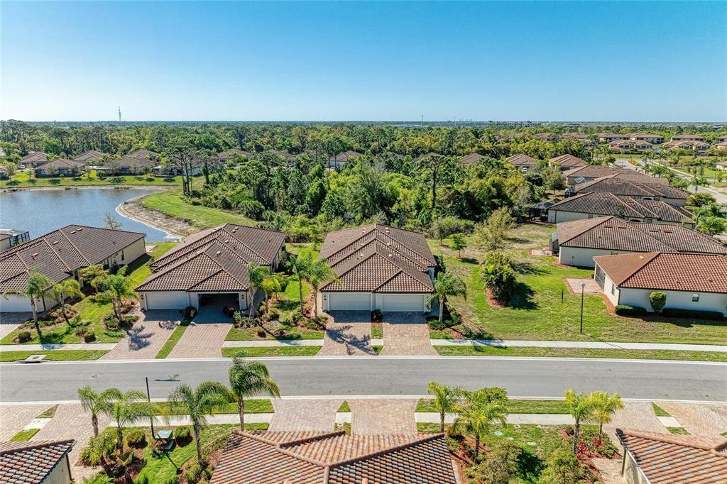12440 Amica Loop Venice, FL 34293 - Photo 6 of 87 an aerial view of residential houses with outdoor space and swimming pool