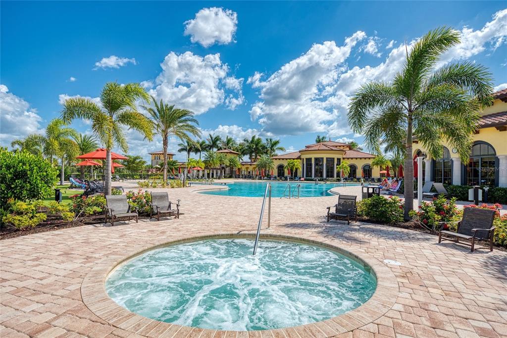 12440 Amica Loop Venice, FL 34293 - Photo 74 of 87 a view of a house with a swimming pool