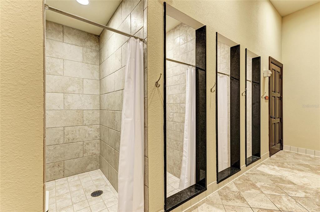 12440 Amica Loop Venice, FL 34293 - Photo 87 of 87 a bathroom with a shower and a glass door