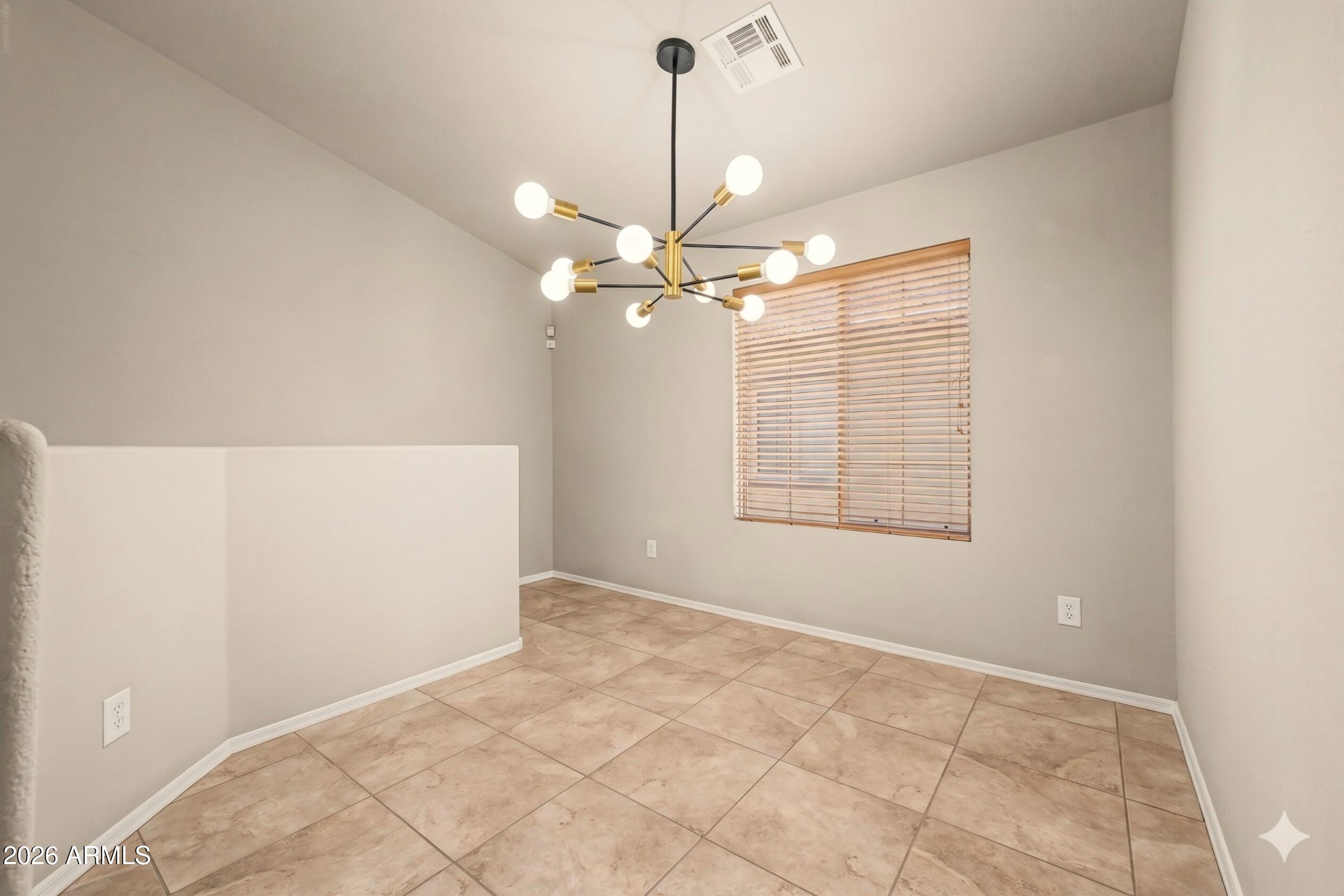 2725 East Mine Creek Road, Unit 2172 Phoenix, AZ 85024 - Photo 13 of 28 a view of an empty room with a window
