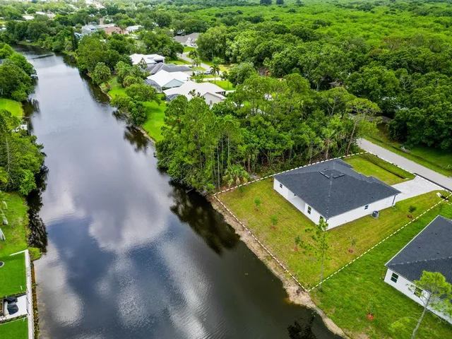 a house with river in front of it