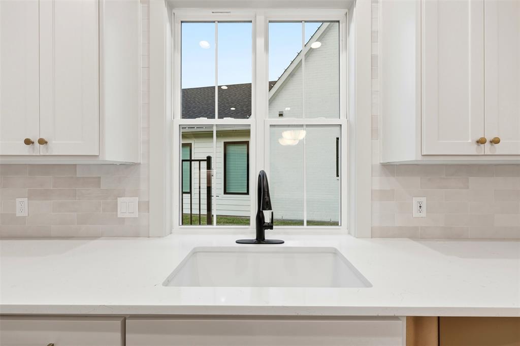 321 Garrett Way Midlothian, TX 76065 - Photo 16 of 28 a view of a kitchen with kitchen island