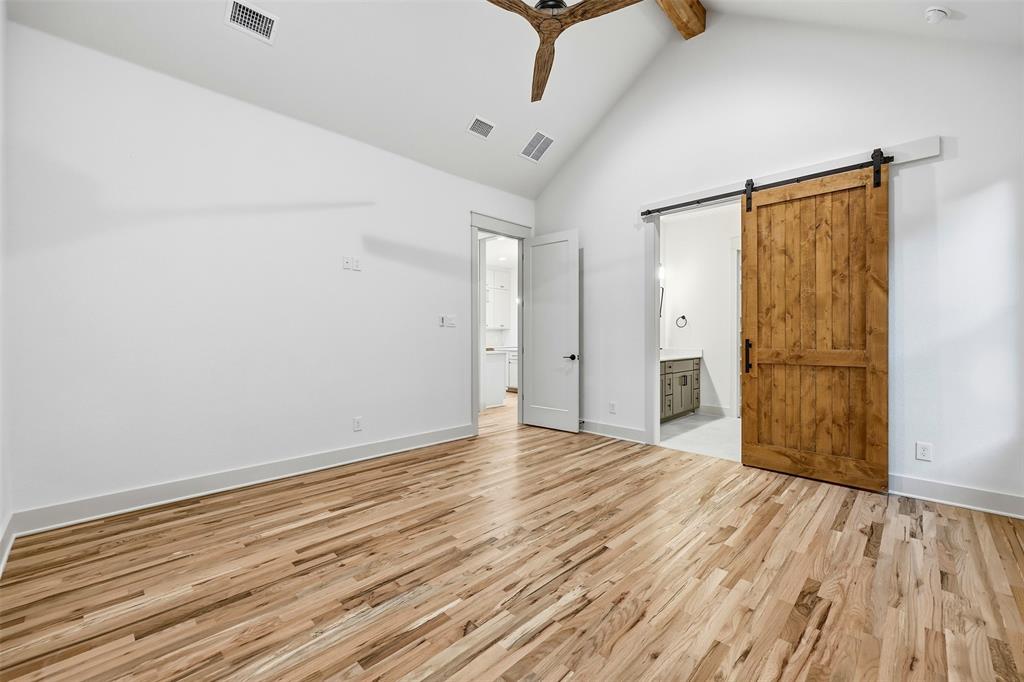 321 Garrett Way Midlothian, TX 76065 - Photo 18 of 28 a view of an empty room with wooden floor and a window
