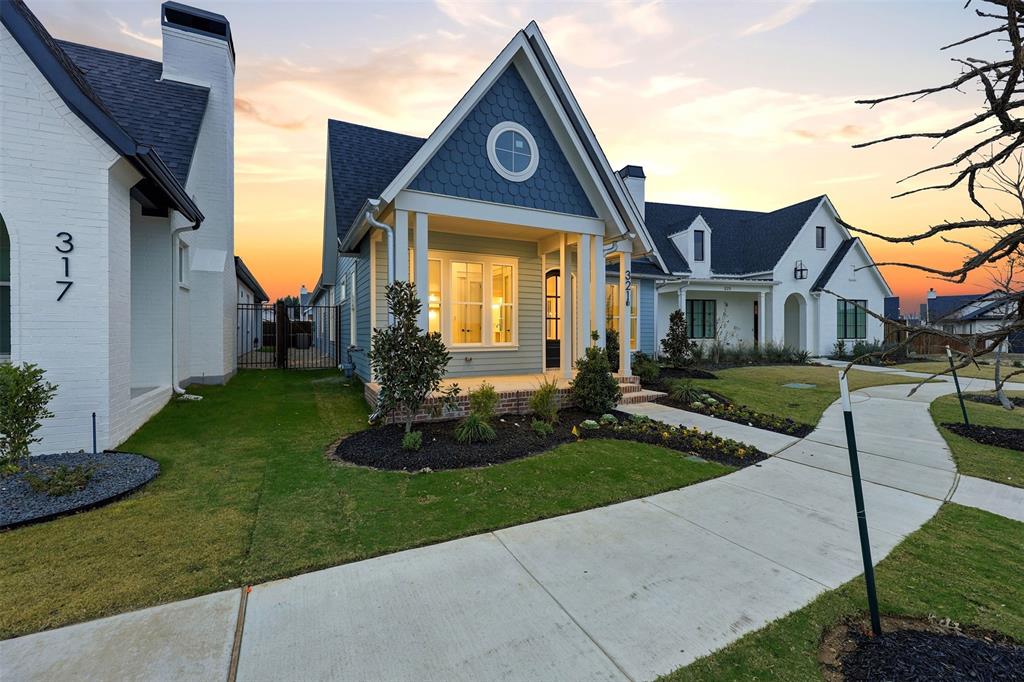 321 Garrett Way Midlothian, TX 76065 - Photo 2 of 28 a front view of a house with a yard