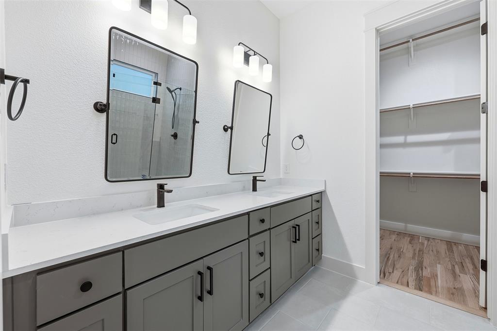 321 Garrett Way Midlothian, TX 76065 - Photo 21 of 28 a bathroom with a double vanity sink mirror and