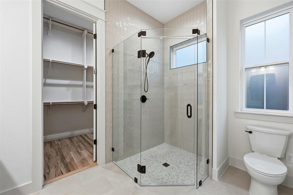 321 Garrett Way Midlothian, TX 76065 - Photo 22 of 28 a bathroom with a shower and toilet