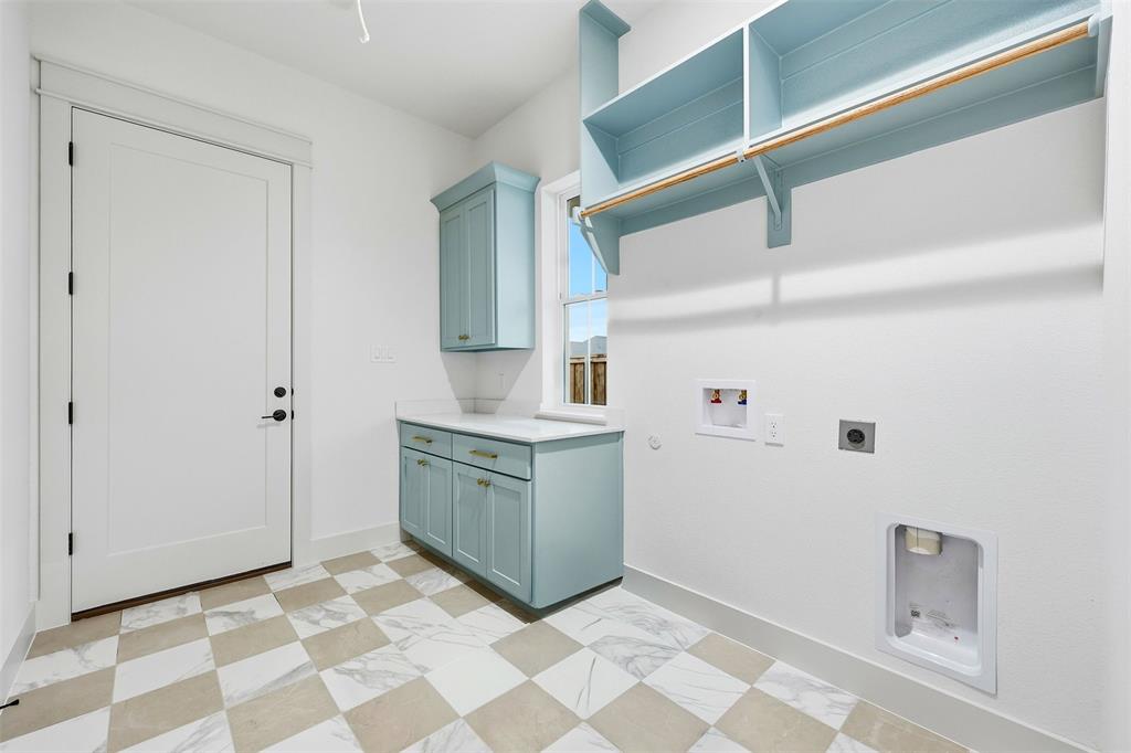 321 Garrett Way Midlothian, TX 76065 - Photo 26 of 28 a room with a washer and dryer