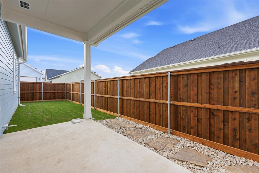 321 Garrett Way Midlothian, TX 76065 - Photo 27 of 28 a view of a backyard with wooden fence