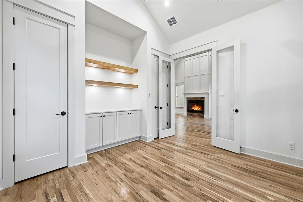 321 Garrett Way Midlothian, TX 76065 - Photo 10 of 28 a view of empty room with wooden floor