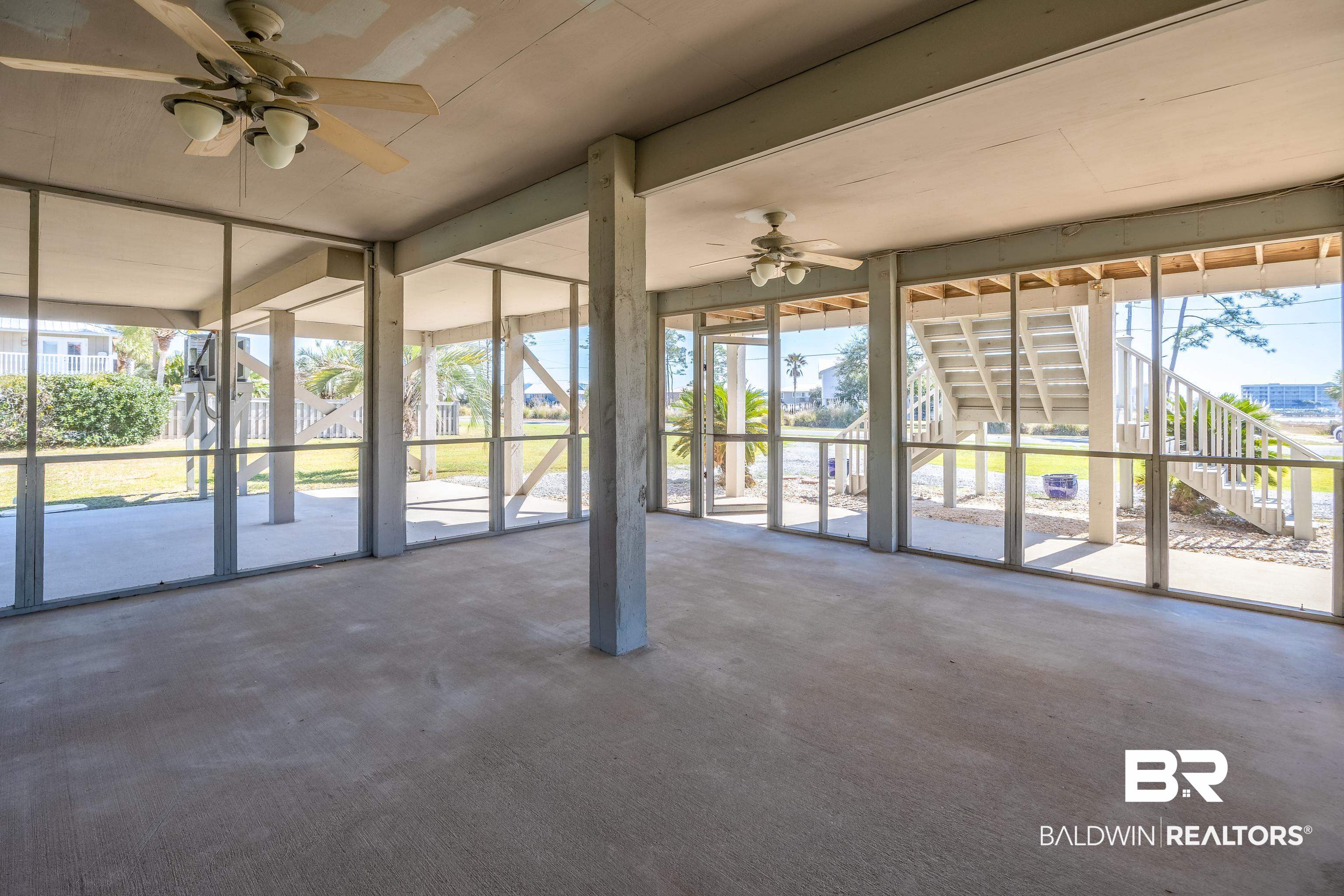 27321 Marina Road Orange Beach, AL 36561 - Photo 11 of 55 Unfurnished sunroom with ceiling fan