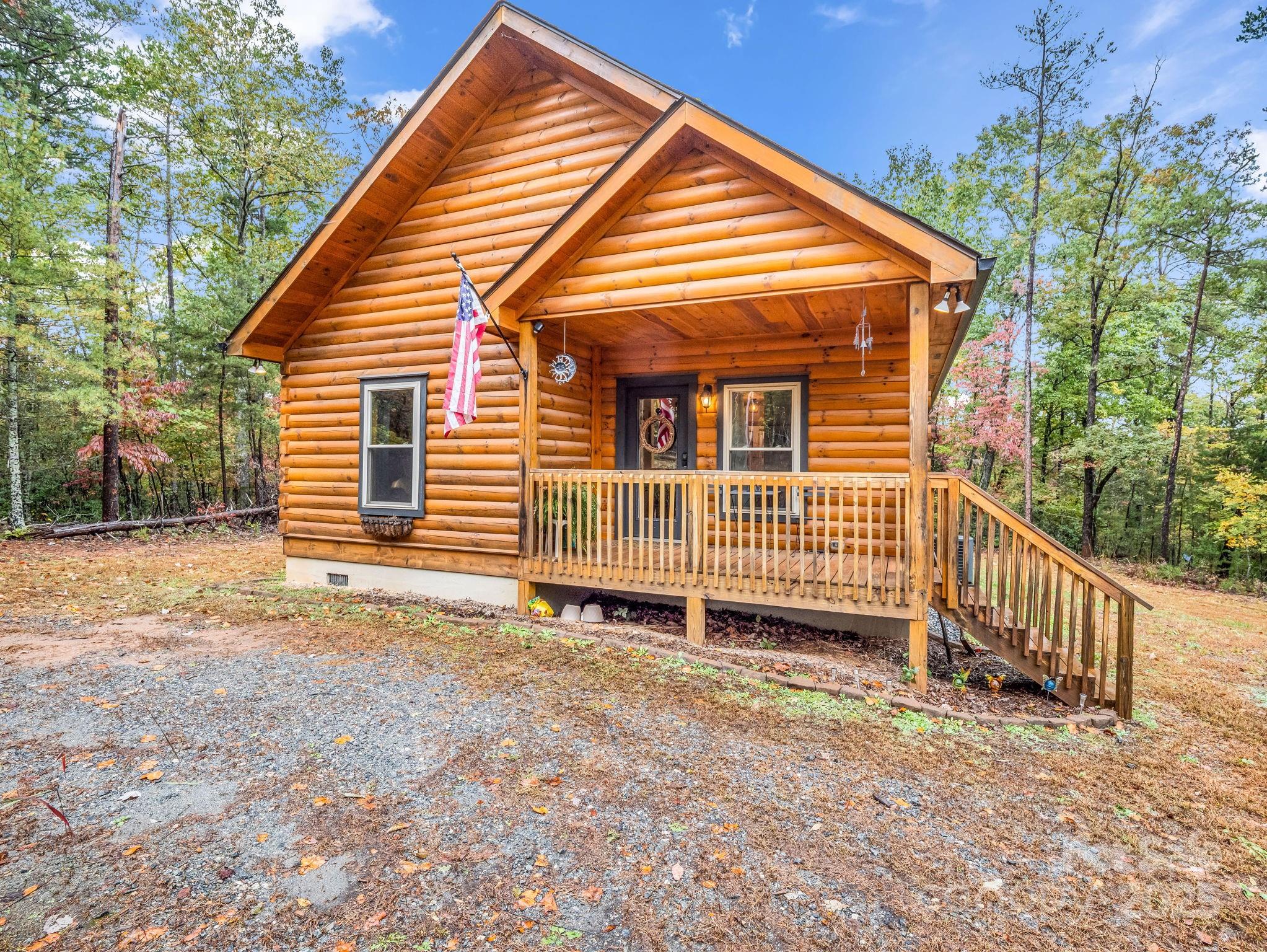174 Doves Way Lake Lure, NC 28746 - Photo 25 of 42 a view of a house with a yard and fence