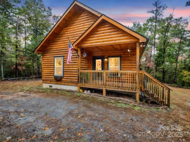 a view of a house with a yard and a backyard