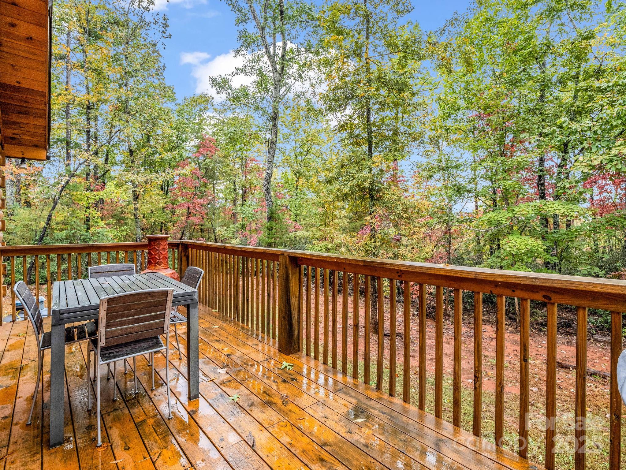 174 Doves Way Lake Lure, NC 28746 - Photo 30 of 42 a balcony with wooden floor and outdoor space