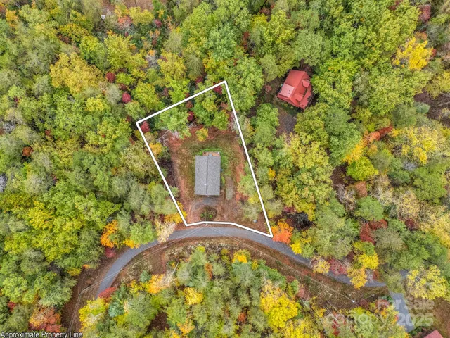 a view of a balcony with a floor to ceiling window and a kitchen