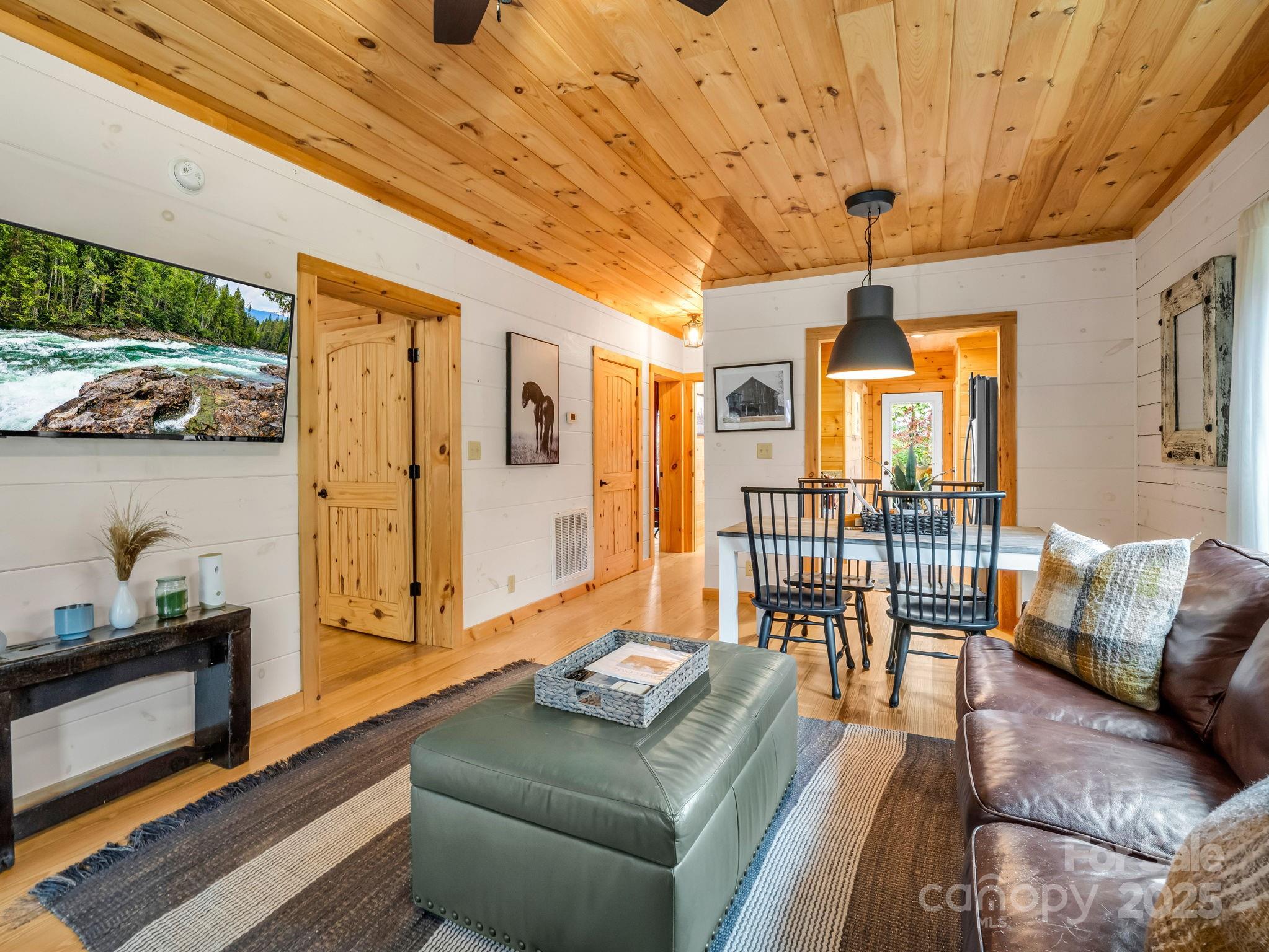 174 Doves Way Lake Lure, NC 28746 - Photo 5 of 42 a living room with furniture and a window