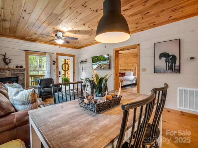 a view of a dining room with furniture window and outside view