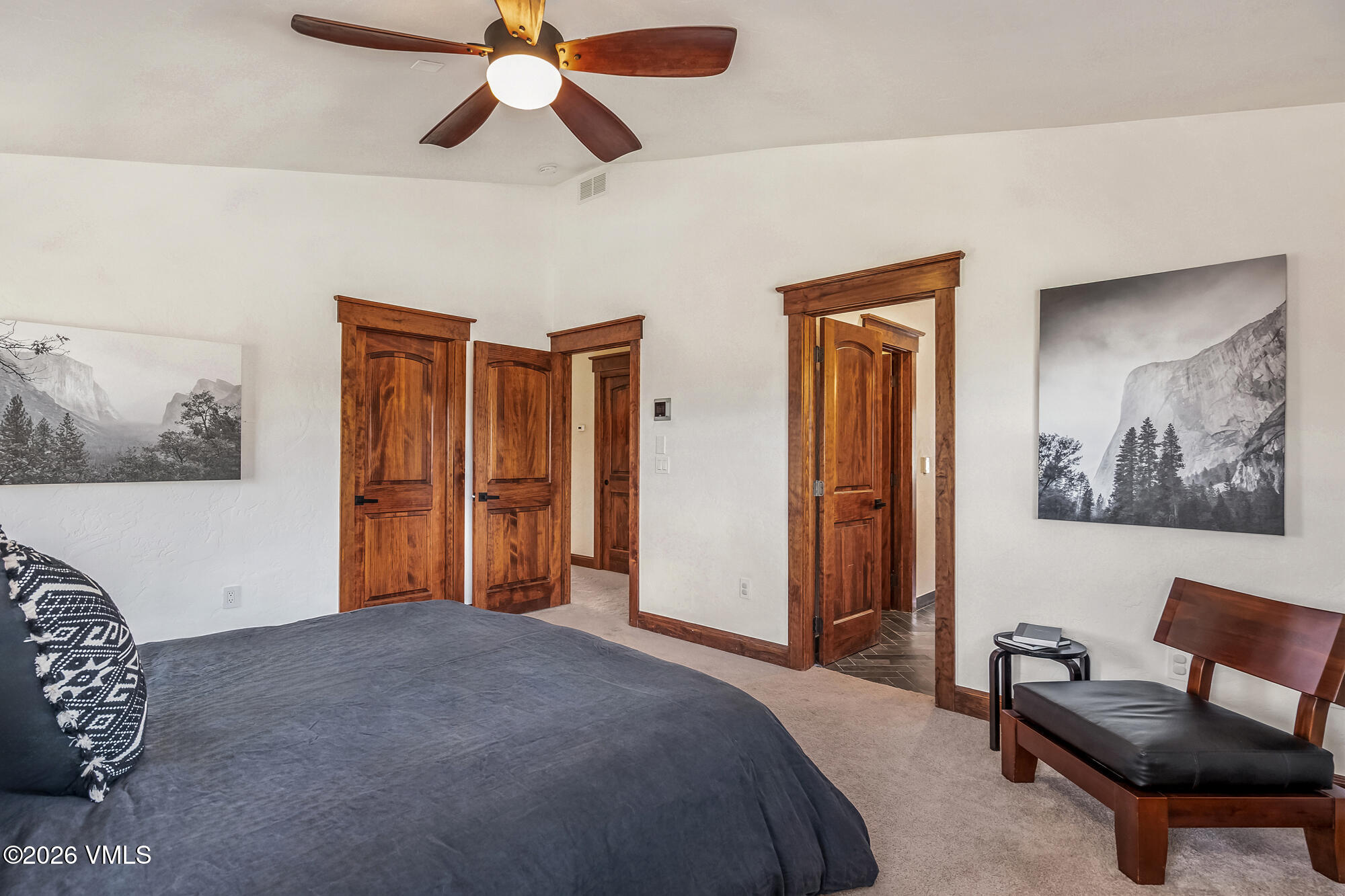 32 Newquist Street Eagle, CO 81631 - Photo 20 of 57 a bedroom with a bed and a chandelier