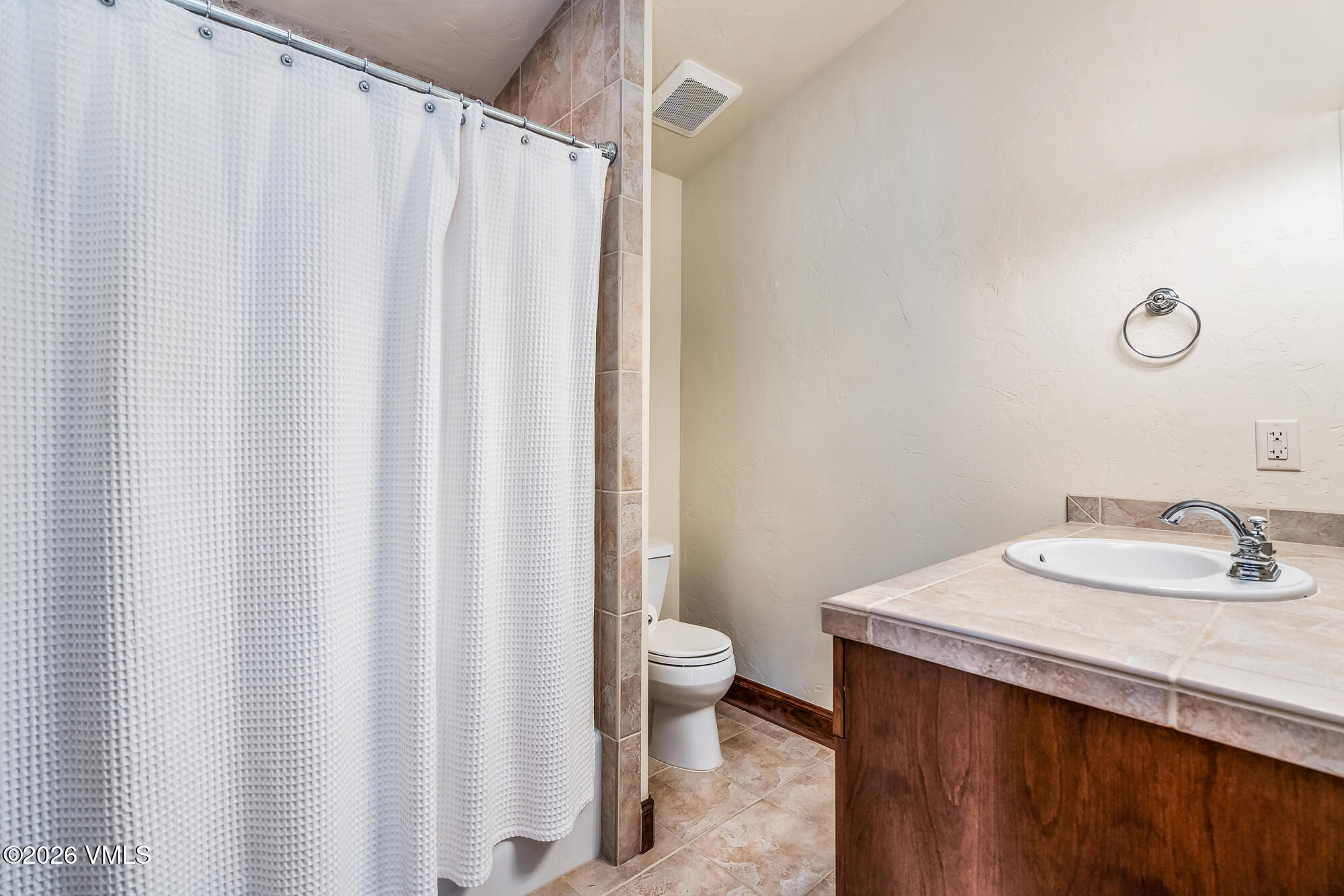 32 Newquist Street Eagle, CO 81631 - Photo 28 of 57 a bathroom with a granite countertop sink and a mirror