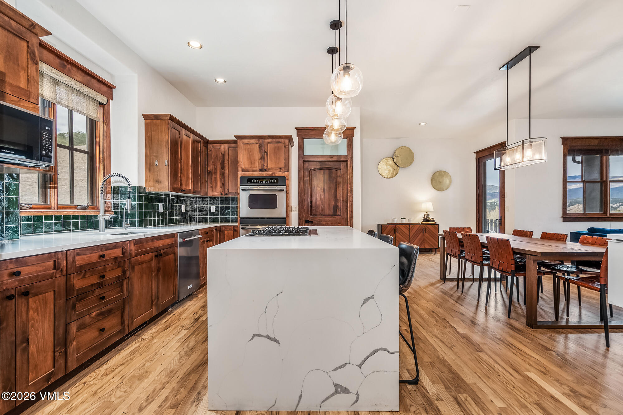 32 Newquist Street Eagle, CO 81631 - Photo 8 of 57 a large kitchen with lots of counter space and stainless steel appliances
