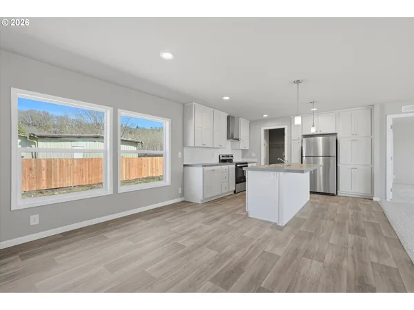 a view of kitchen with wooden floor