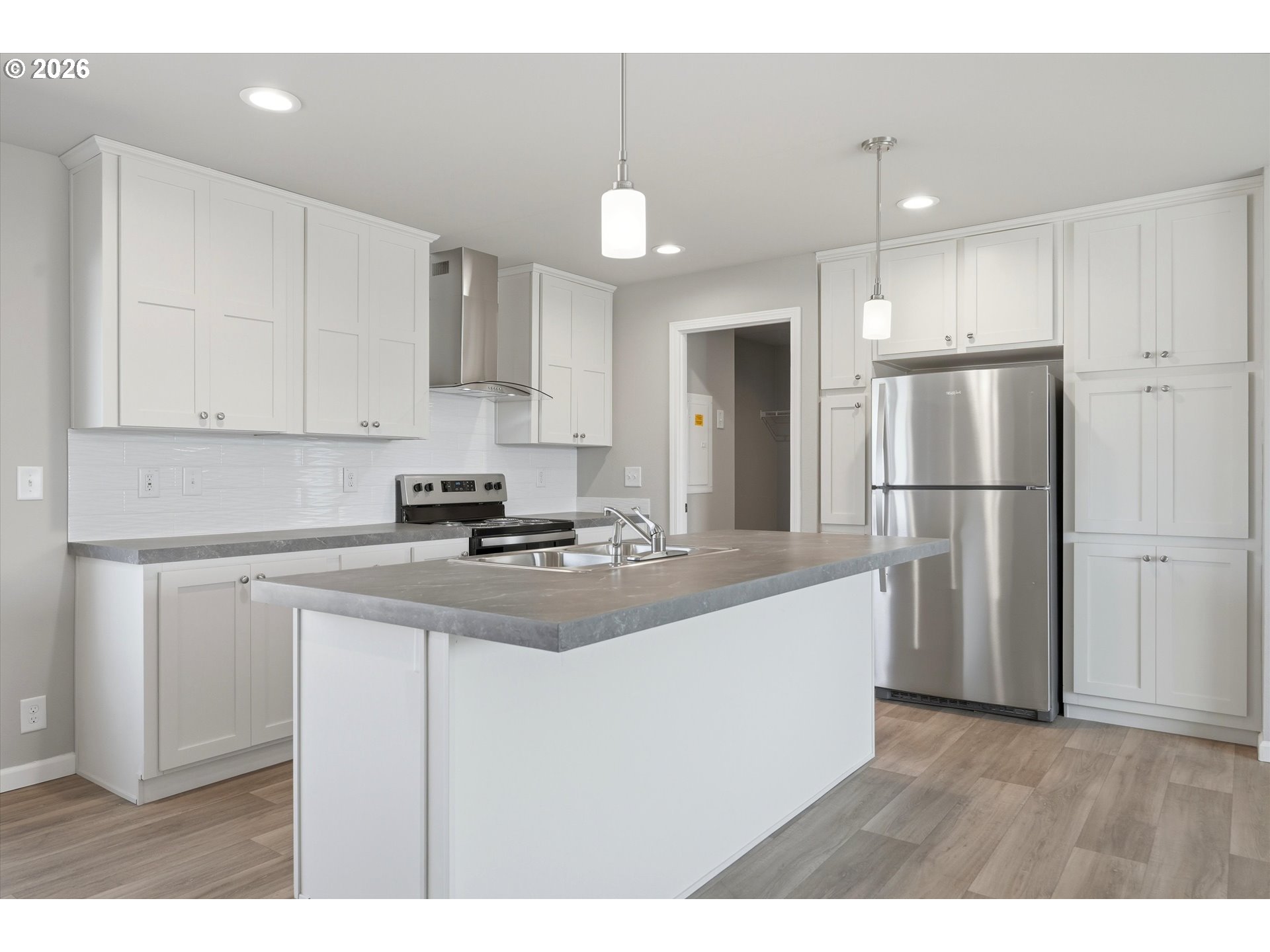 412 Rosedell Street Amity, OR 97101 - Photo 14 of 38 a kitchen with kitchen island a sink stainless steel appliances and cabinets