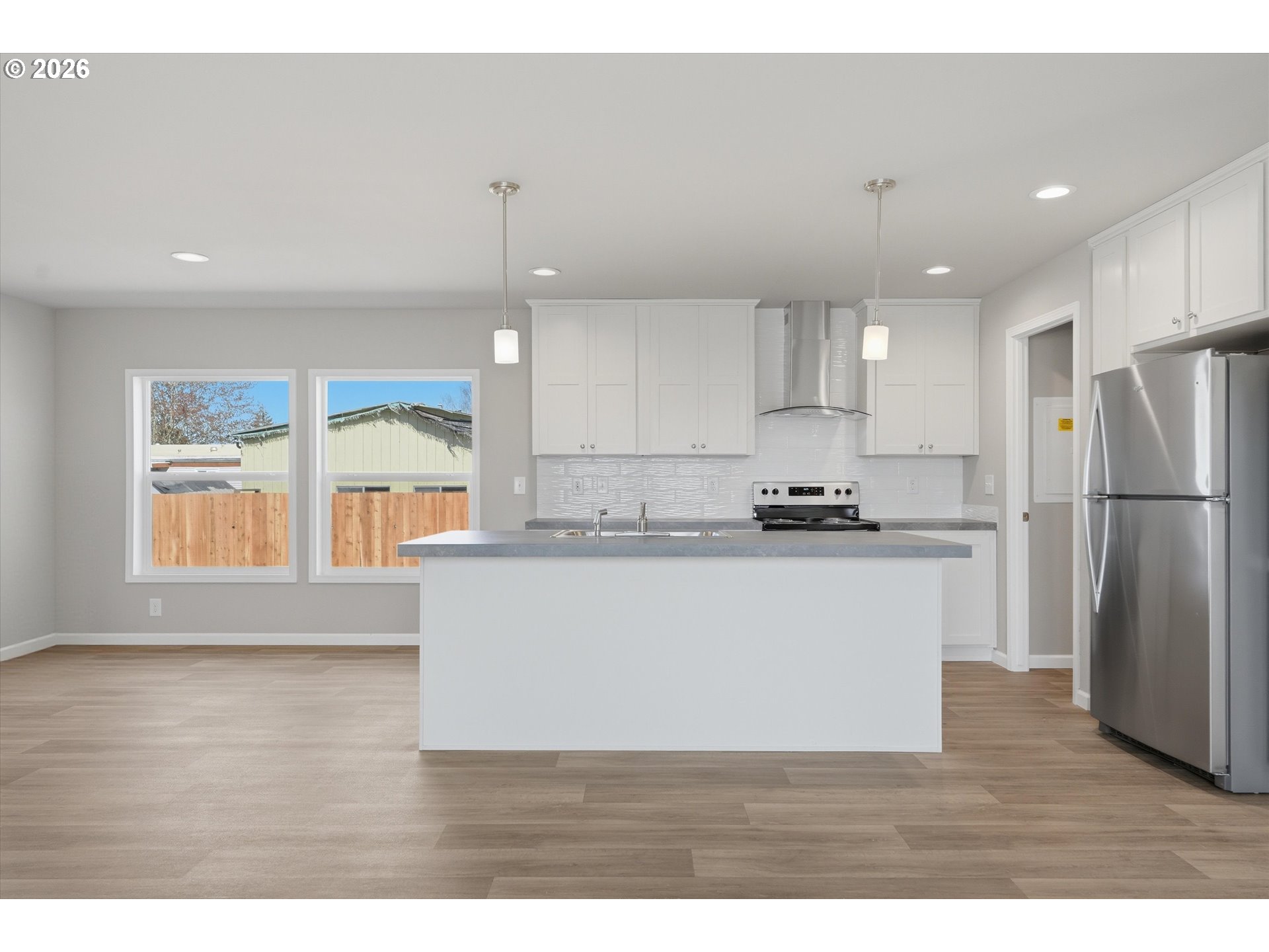 412 Rosedell Street Amity, OR 97101 - Photo 10 of 38 a view of kitchen with wooden floor